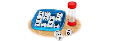representation of dices with letters to form English words and a small container. 
